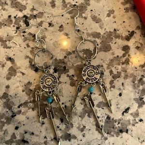 Silver bullet dangle earrings